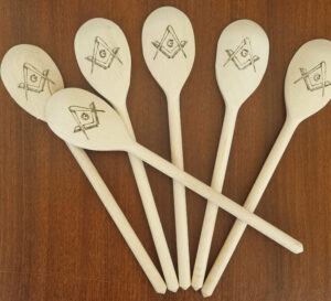 A set of 6 wooden spoons with Square and Compass pyrographied into them