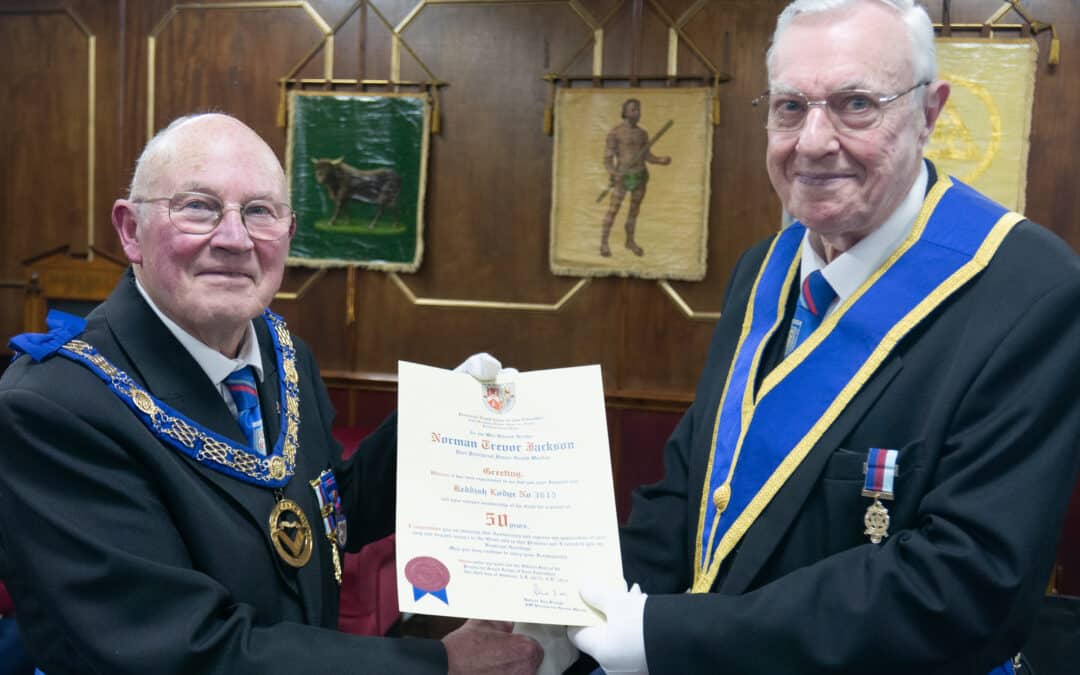 Certificate of 50 years in Freemasonry being presented